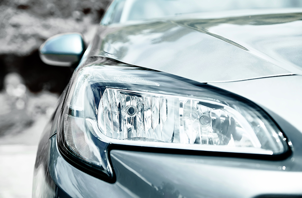 Closeup headlights of gray car